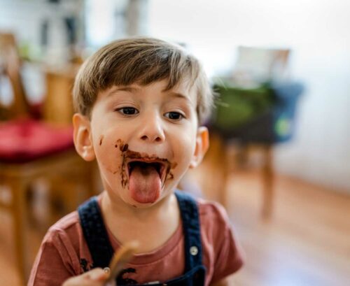 Little boy with chocolate on his face