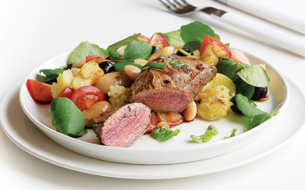 Lamb steaks with crushed bean and new potato salad