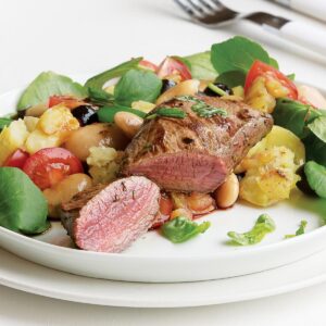 Lamb steaks with crushed bean and new potato salad