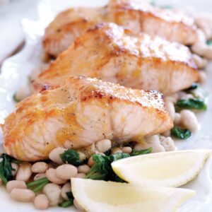 Maple-glazed salmon with spinach and white beans