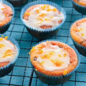 Orange choc-chip muffins with orange icing