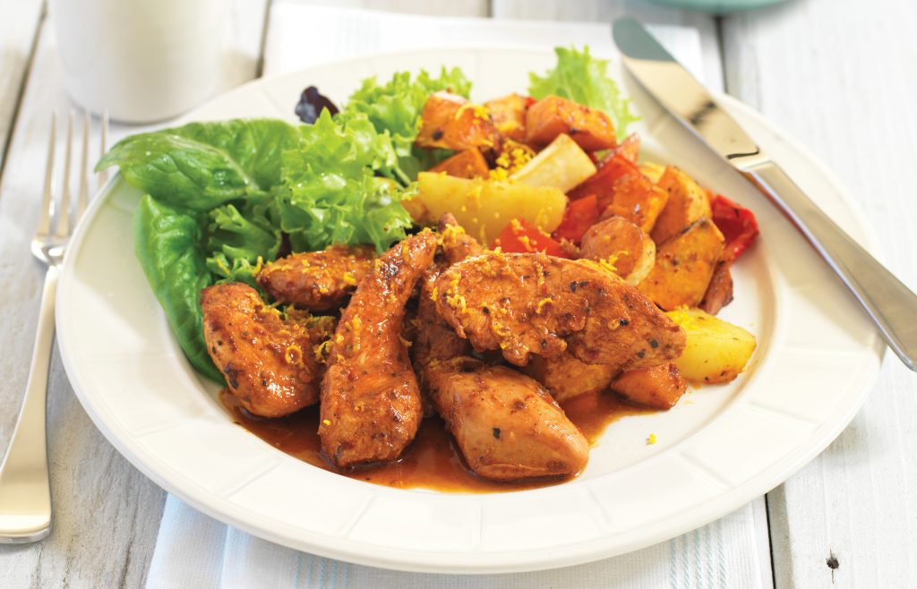 Portuguese chicken tenderloins on warm roasted vegetable salad