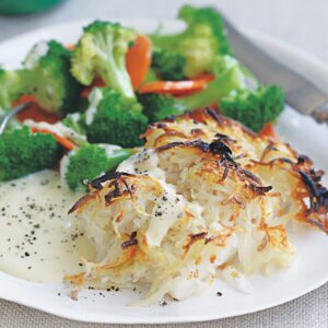 Rosti-topped fish with cheese sauce