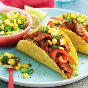 Sizzling pork tacos with corn and lime salsa
