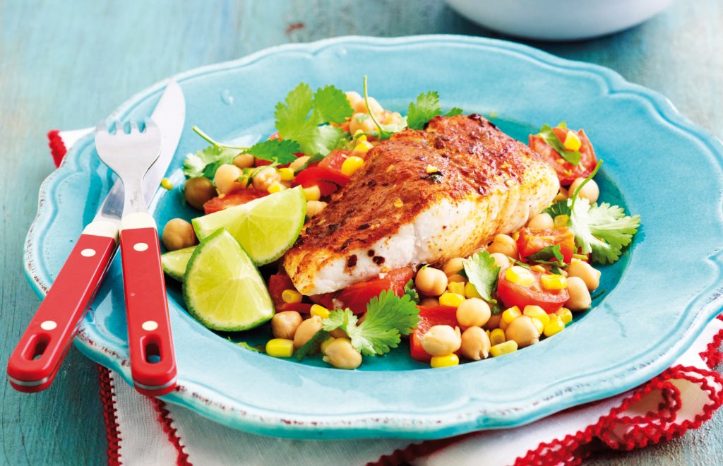 Spice-rubbed fish with roasted corn and tomato salad