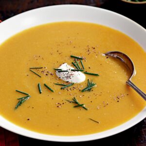 Spiced pumpkin soup with sour cream and chives