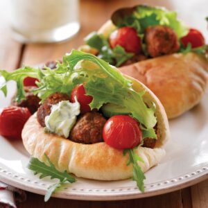 Spicy meatballs with roasted tomatoes and tzatziki