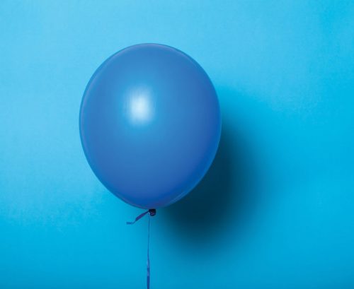 Blue balloon on a blue background