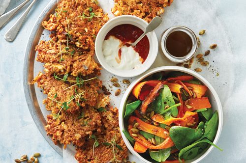 Cauliflower and potato fritters with winter spinach and roasted carrot salad