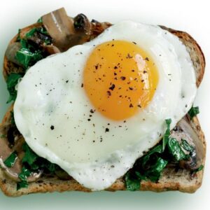 Egg, mushroom and wilted kale toast topper