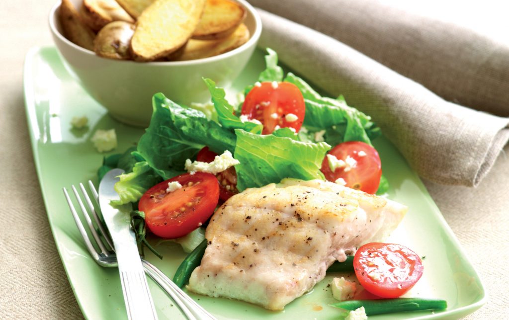 Fish and chips with tomato salad