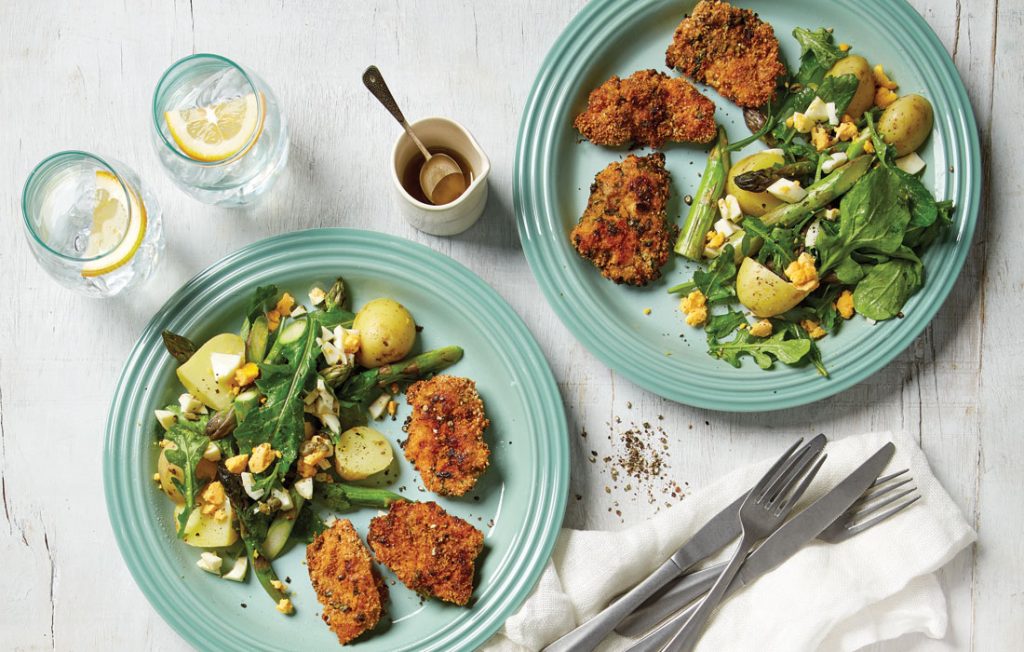 Herb-crumbed chicken with asparagus, potato and egg salad