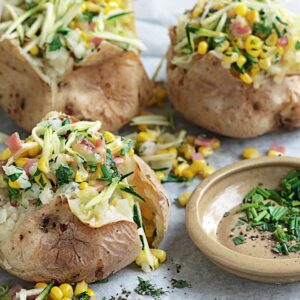 Jacket potato with bacon, corn, chives and cheddar