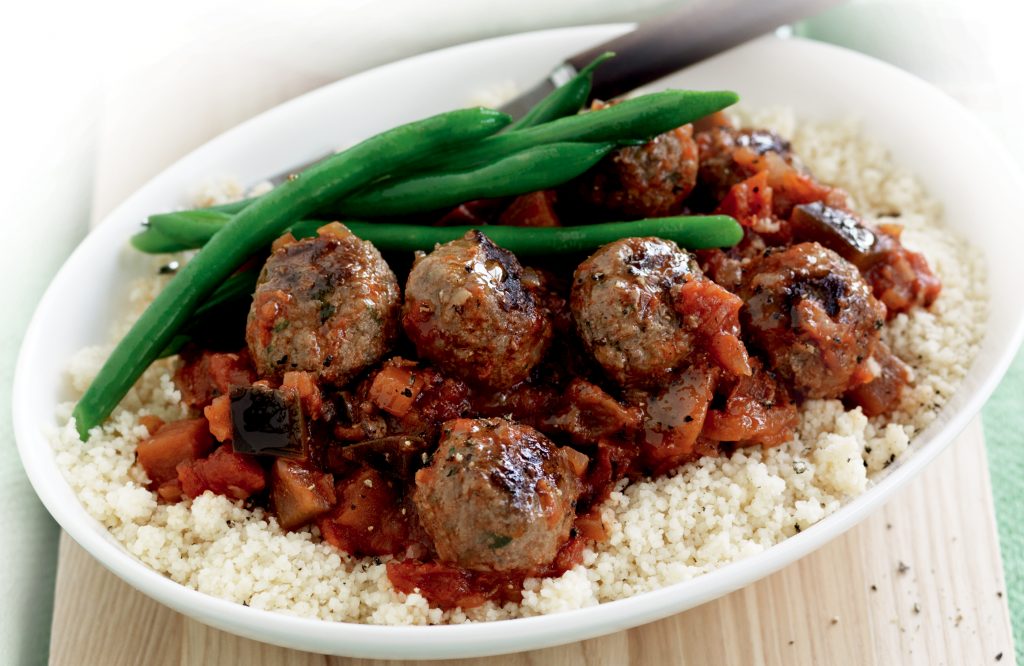 Meatballs in tomato and eggplant sauce with couscous