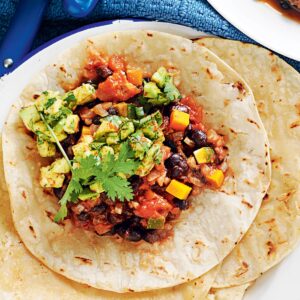 Mexican black beans with spicy avocado and grilled tortilla