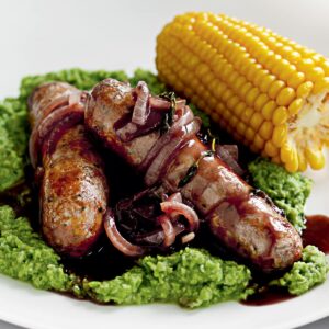 Sausages with pea purée and onion gravy