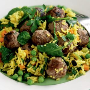 Spiced pilaf with meatballs, currants and baby spinach