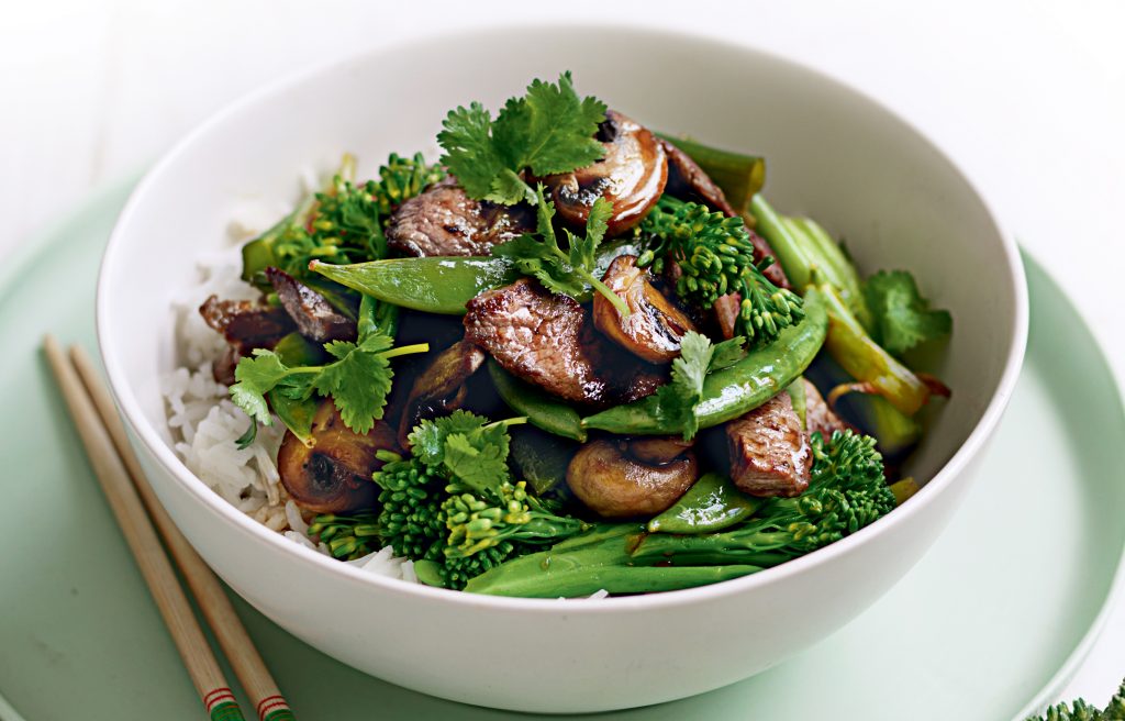 Stir-fried beef with mushrooms, peas and broccolini