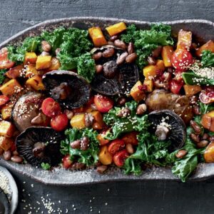 Warm roasted mushroom, kale and pumpkin salad with soy-chilli dressing