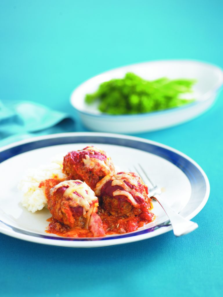Cheese and tomato-topped lamb meatballs
