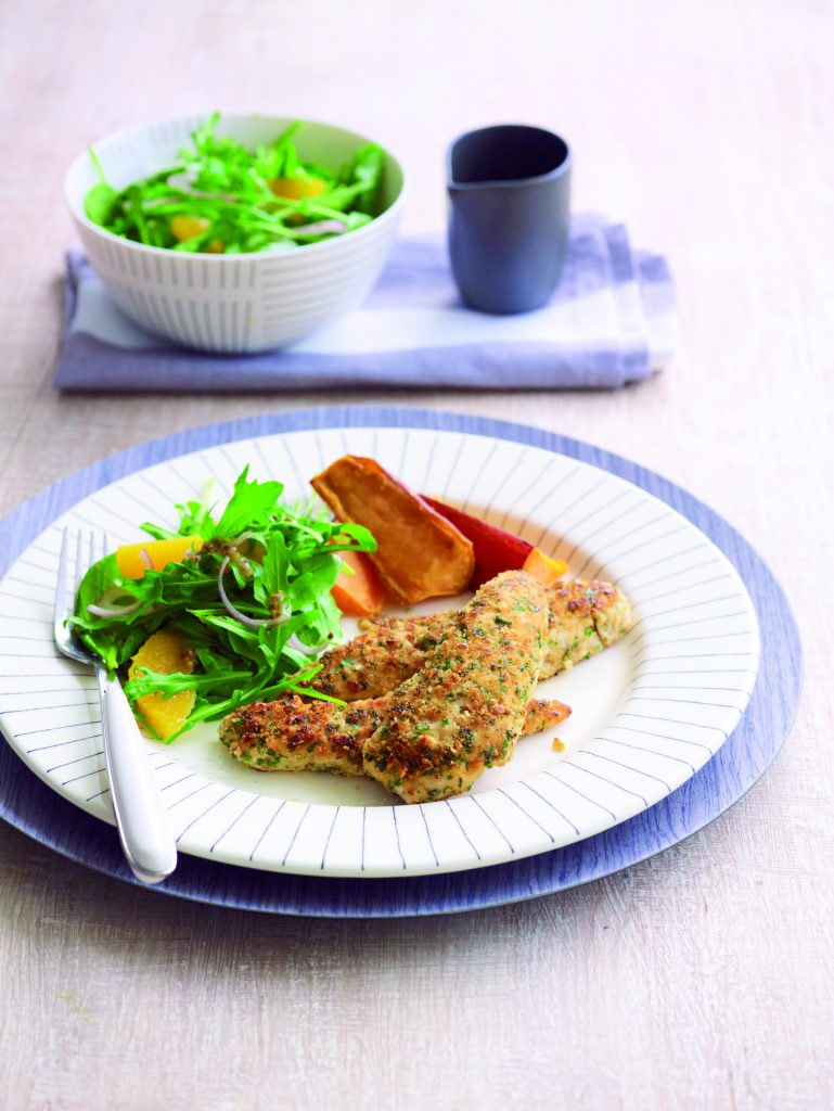 Crumbed chicken with rocket salad and wedges
