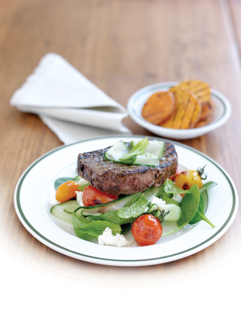 Grilled fillet steak with charred tomato and feta salad