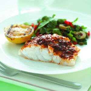 Grilled fish and lemon with olive salad