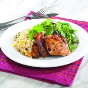Grilled spiced chicken on fruity couscous