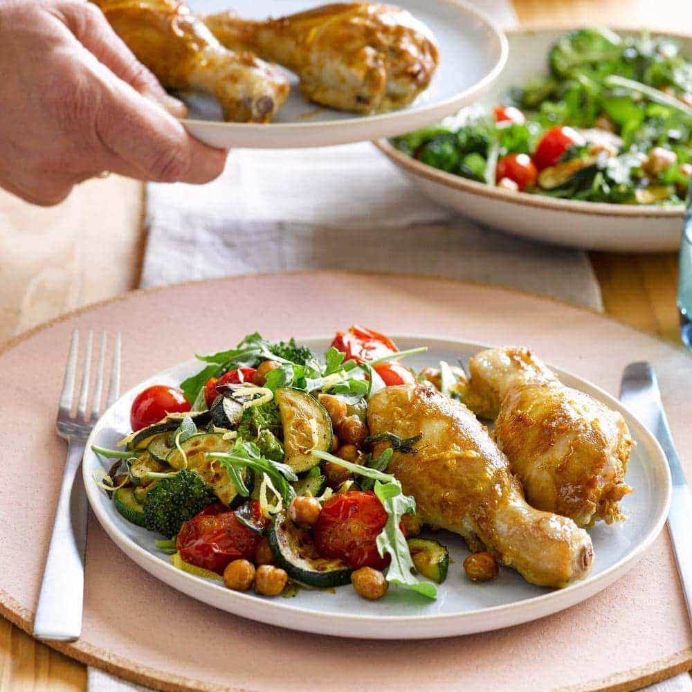 Mustard chicken with roasted chickpeas, tomatoes and garlicky greens