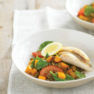 Pan-fried fish with lentil and spinach salad