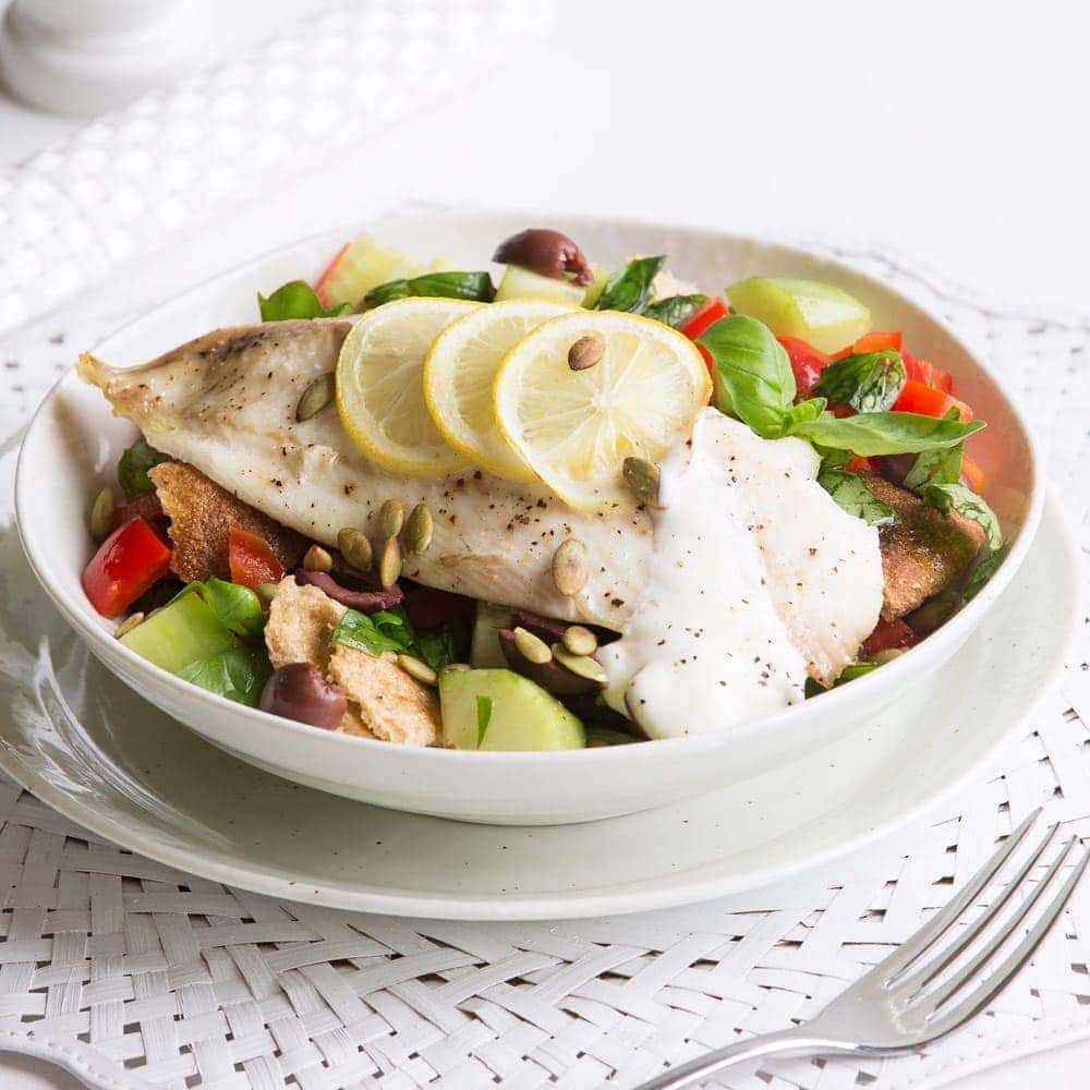 Quick lemon-roasted fish with tomato and olive salad