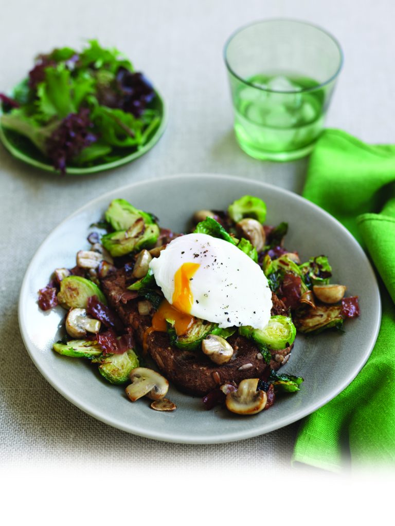 Sautéed sprouts and mushrooms with poached egg