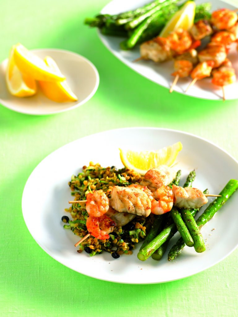 Seafood skewers with lentil salad