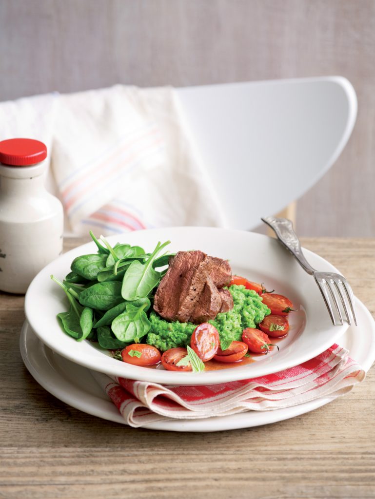 Seared lamb with mint pea mash and roasted tomatoes
