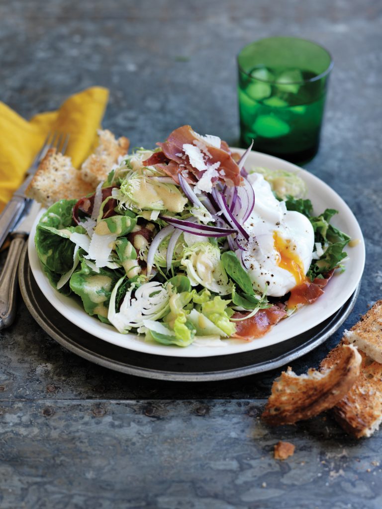 Shaved Brussels sprout salad with prosciutto and poached eggs