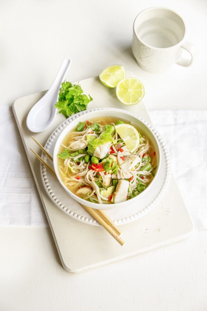 Soba noodle soup with fish and Asian greens