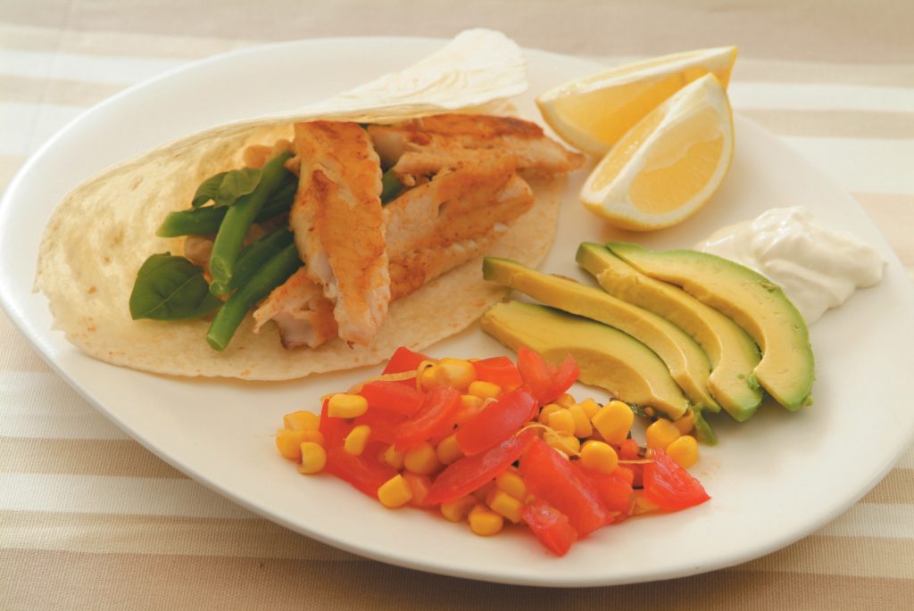 White and green bean tortillas with crispy fish and corn and tomato salsa
