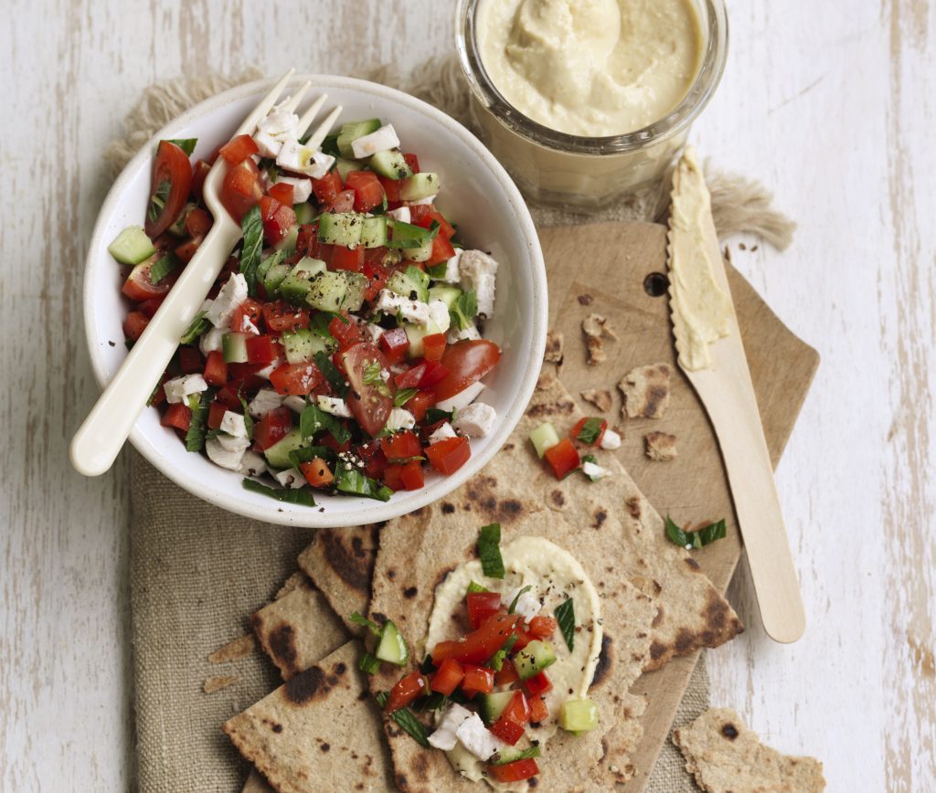 Chicken, tomato and cucumber salad with hummus