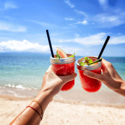 Sharing drinks on a beach