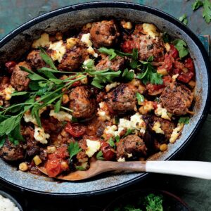 Baked meatballs with tomato, olives and ricotta