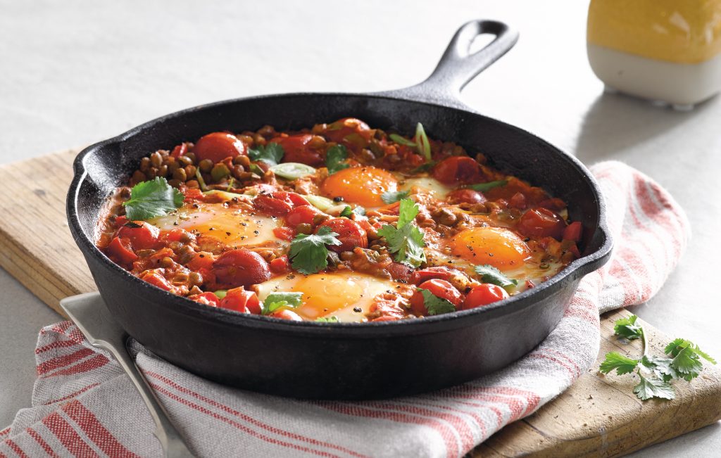 Mexican baked eggs with tomatoes and lentils