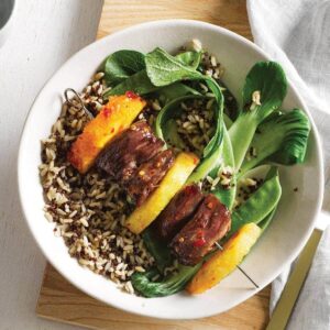 Sticky lamb kebabs with greens