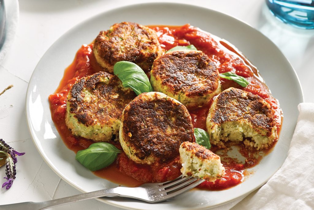 White bean, cauli and courgette patties with spicy tomato and basil sauce