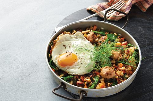 Vegetable and sausage pilaf with egg