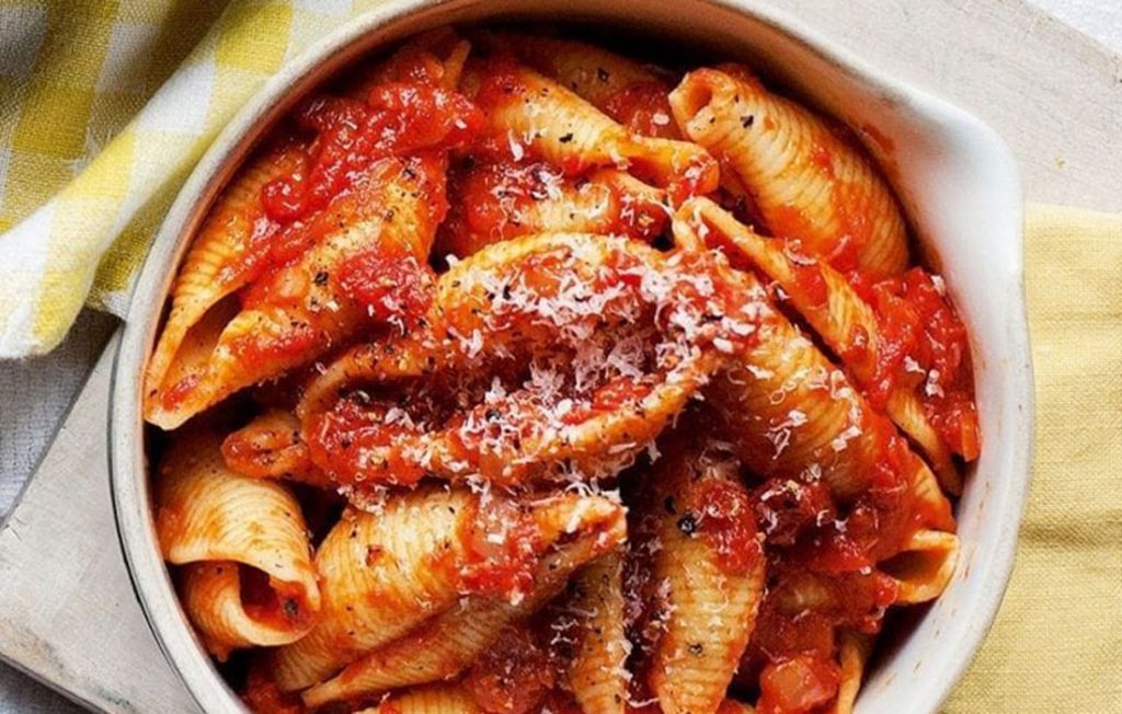 Healthier conchiglie pasta in rich tomato sauce