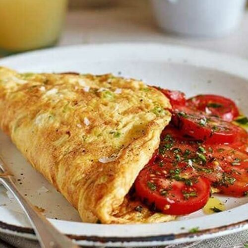 Herby cheese and tomato omelette