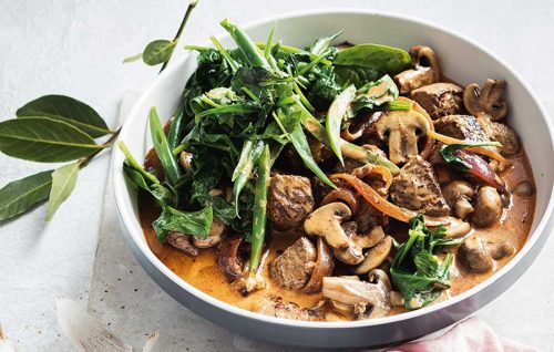 Beef and mushroom stroganoff with garlic spinach and beans