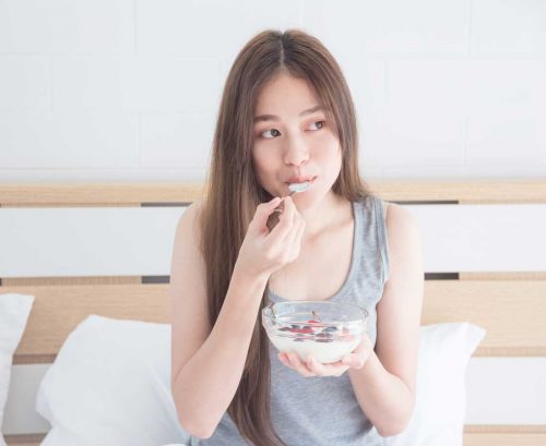 Woman eating yoghurt