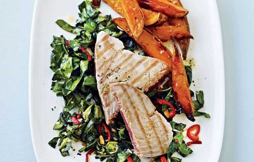 Tuna steaks with sweet potato wedges and greens
