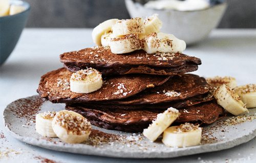 Chocolate pancakes with coconut and bananas